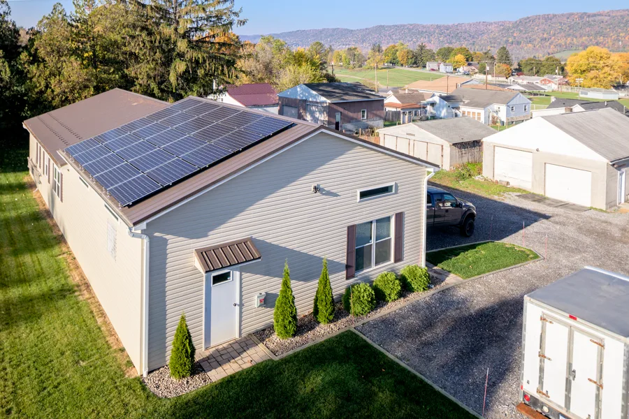 Low commercial building in Bellefonte carrying a long roof array