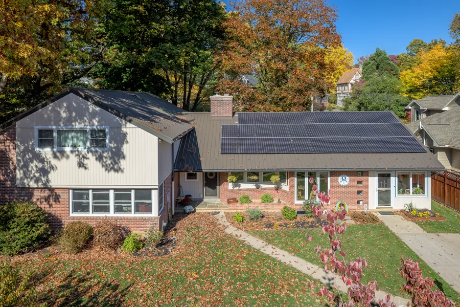 Brick ranch home in State College with a full rooftop solar array